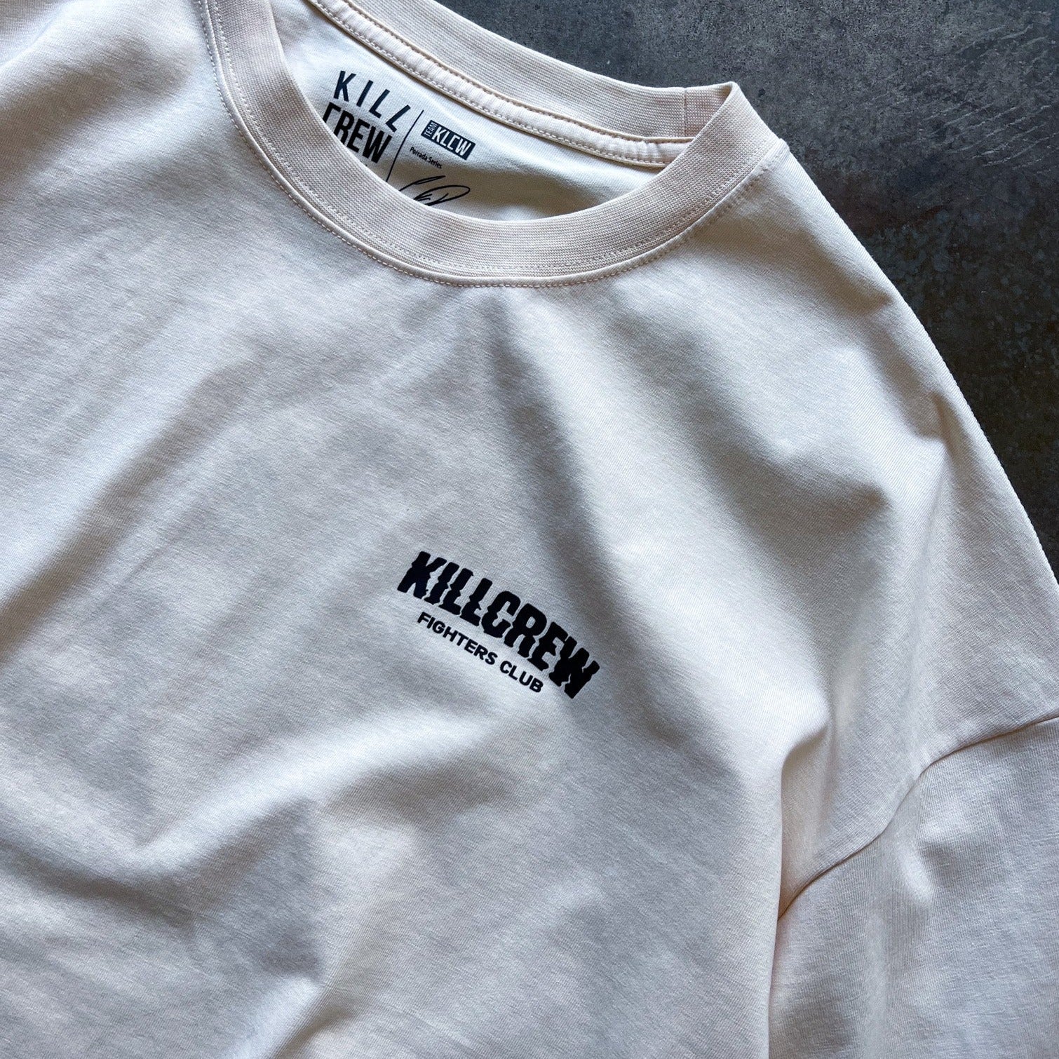 RELAXED FIT RIGOROUS TRAINING T-SHIRT - CREAM / BLACK
