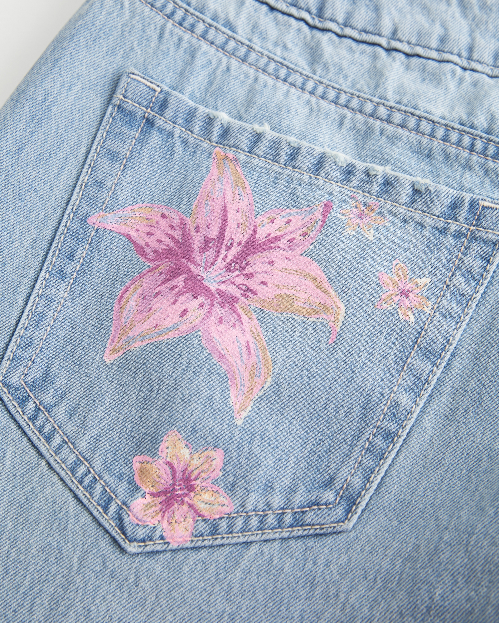 Ultra Low-Rise Light Wash Buckle Back Baggy Jeans