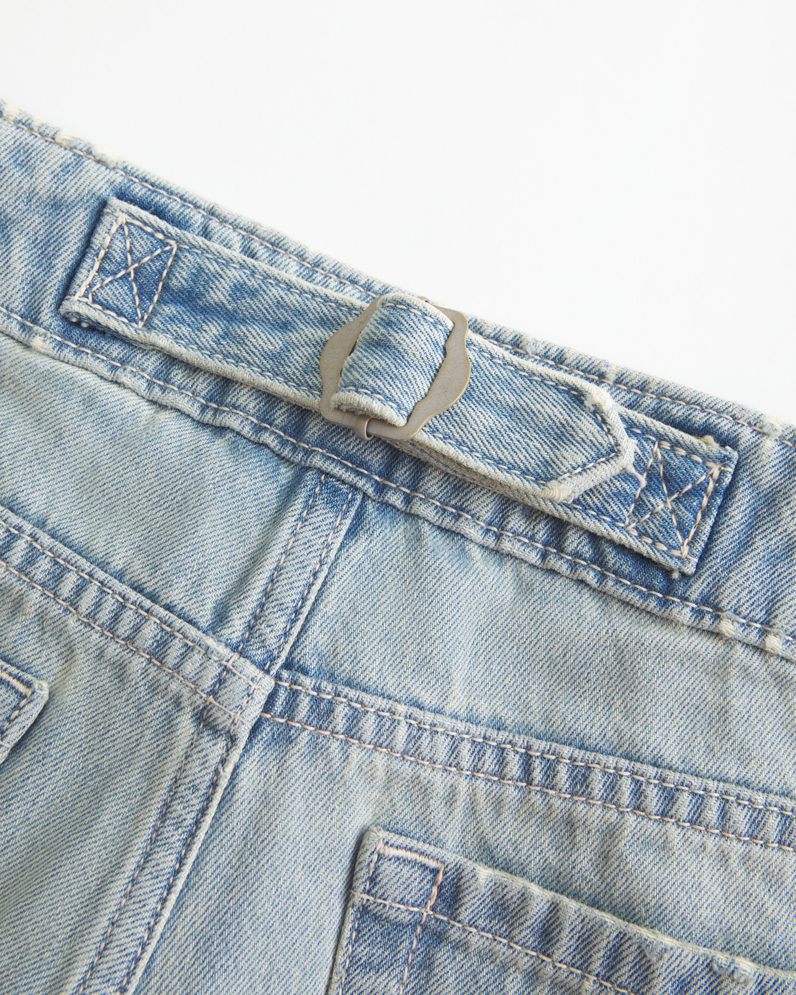 Ultra Low-Rise Light Wash Buckle Back Baggy Jeans