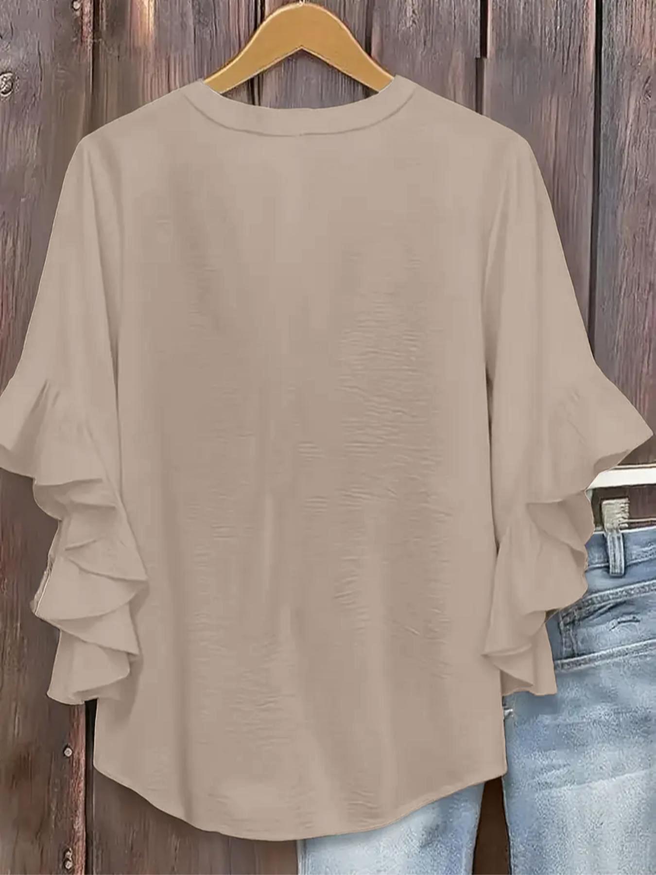 Plus-size women's V-neck blouse with ruffle sleeves and an elegant floral print