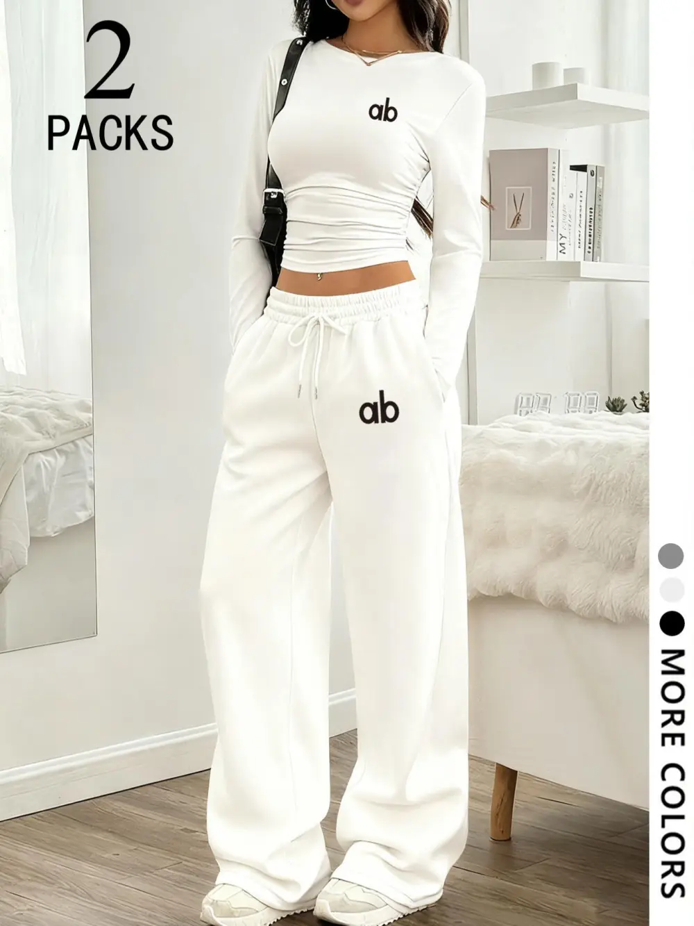Women's two-piece set: a casual, loose-fitting long-sleeved top paired with straight-leg trousers.
