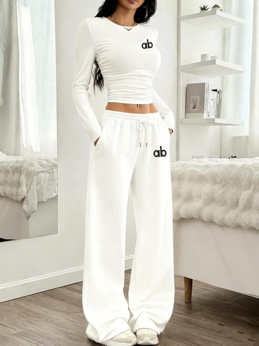 Women's two-piece set: a casual, loose-fitting long-sleeved top paired with straight-leg trousers.