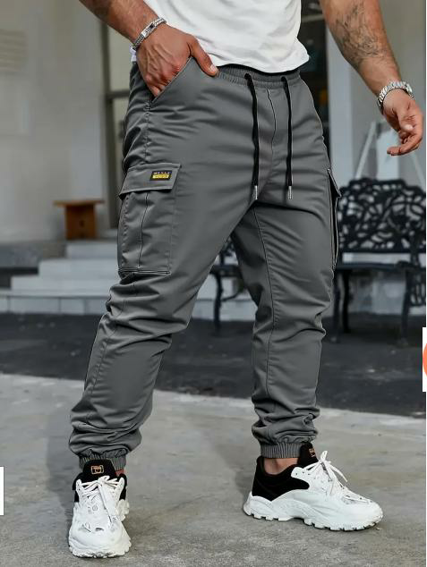 Men's solid color tactical work pants with multiple pockets and drawstring design