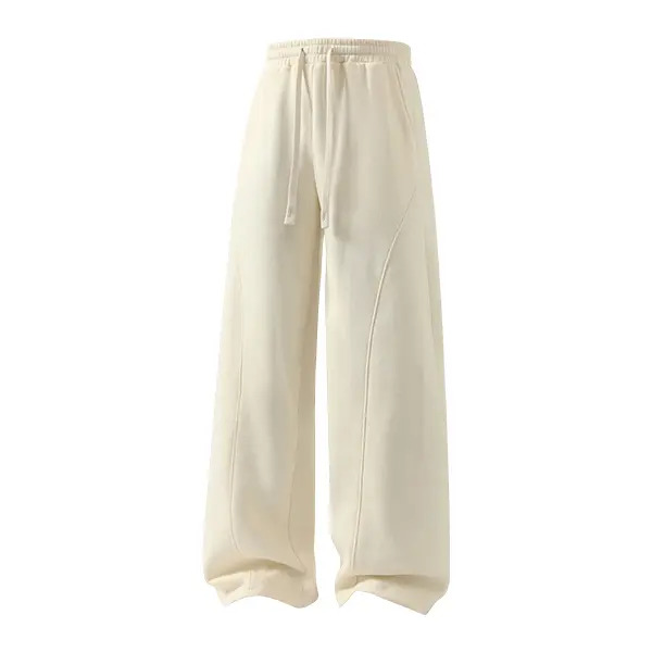 Men's solid-color drawstring trousers featuring a curved cut design.