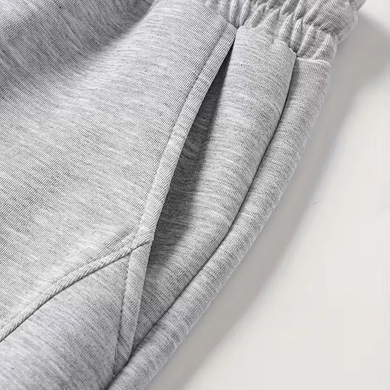 Men's unisex wide-leg sweatpants, loose and breathable polyester casual trousers with drawstring design, and solid color paneling