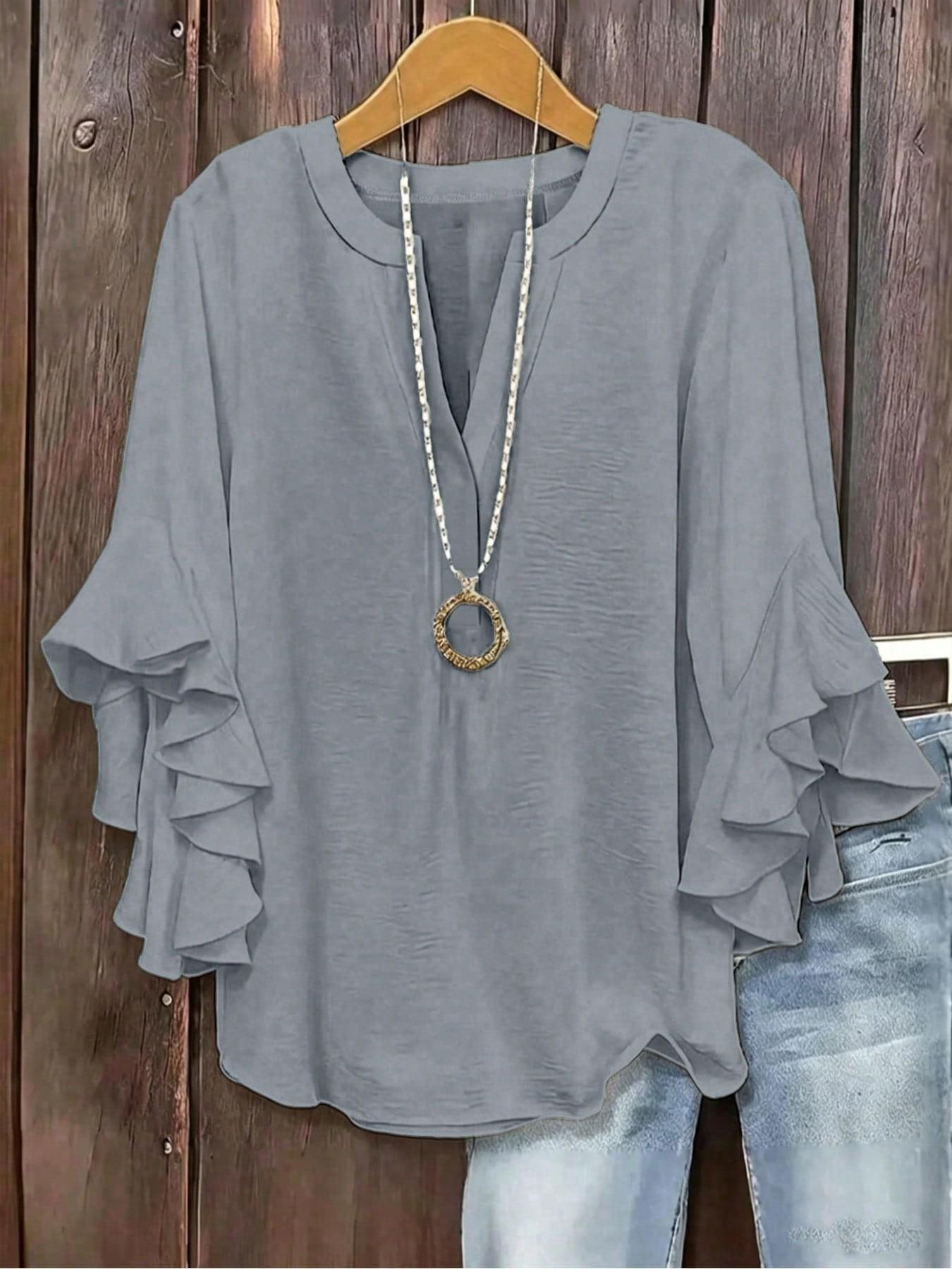 Plus-size women's V-neck blouse with ruffle sleeves and an elegant floral print