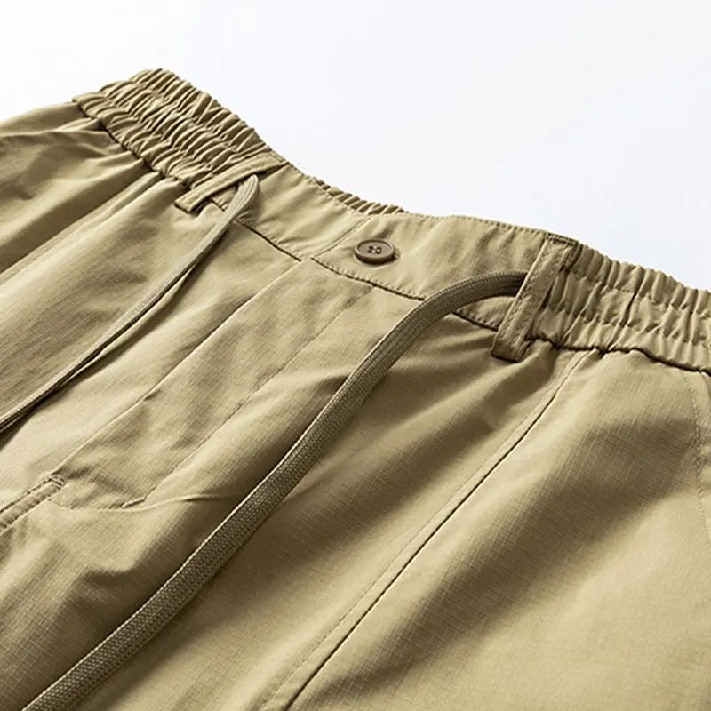 Men’s casual cargo shorts with zippered pockets and a buttoned placket