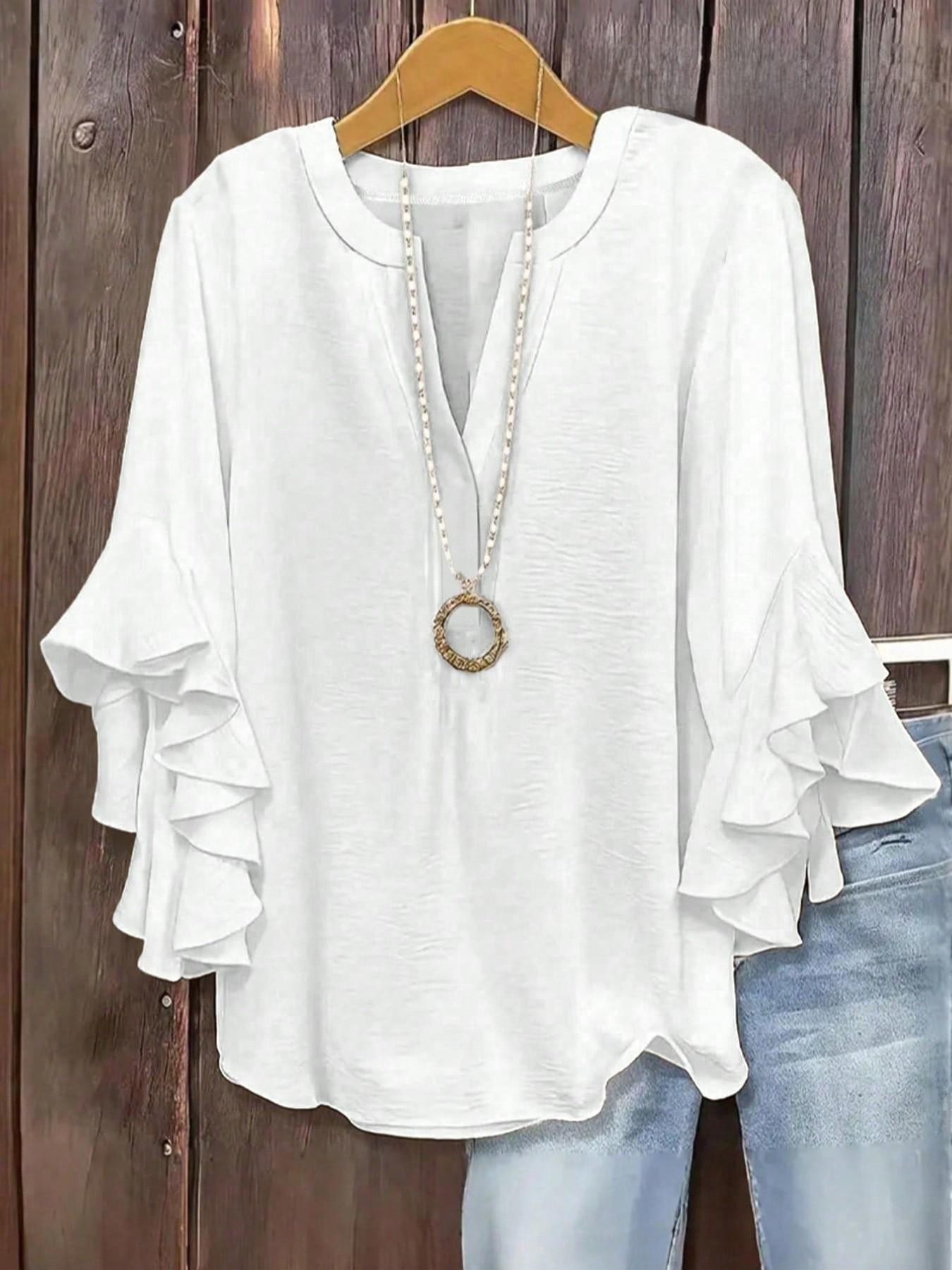 Plus-size women's V-neck blouse with ruffle sleeves and an elegant floral print