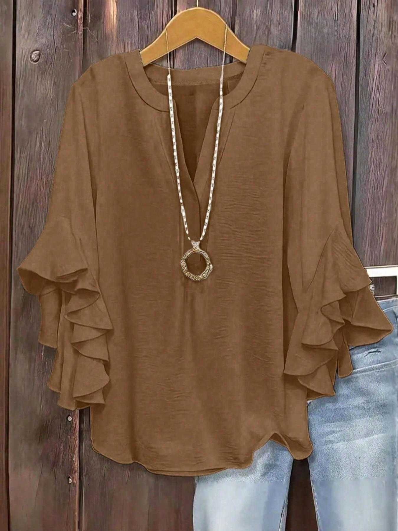 Plus-size women's V-neck blouse with ruffle sleeves and an elegant floral print