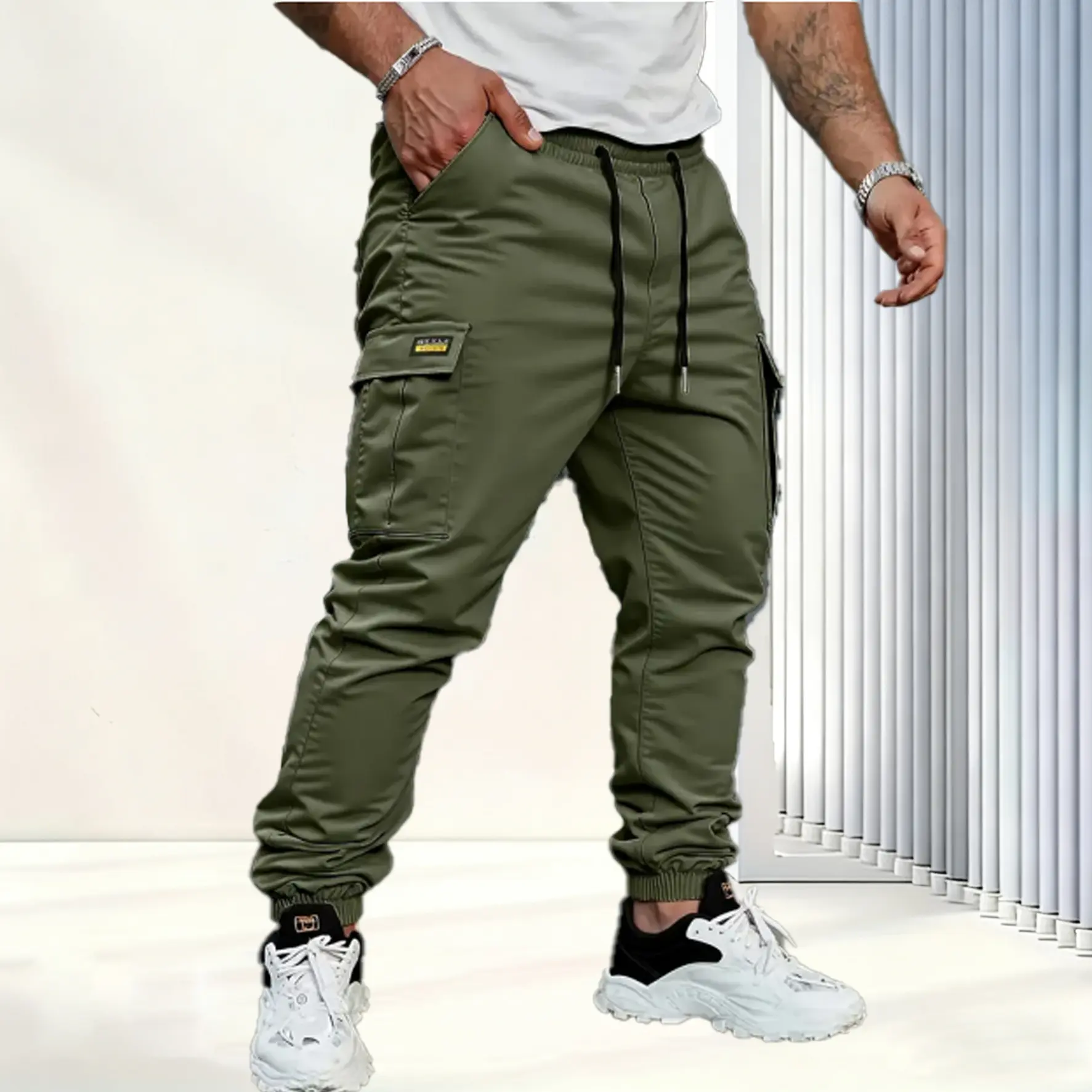 Men's solid color tactical work pants with multiple pockets and drawstring design