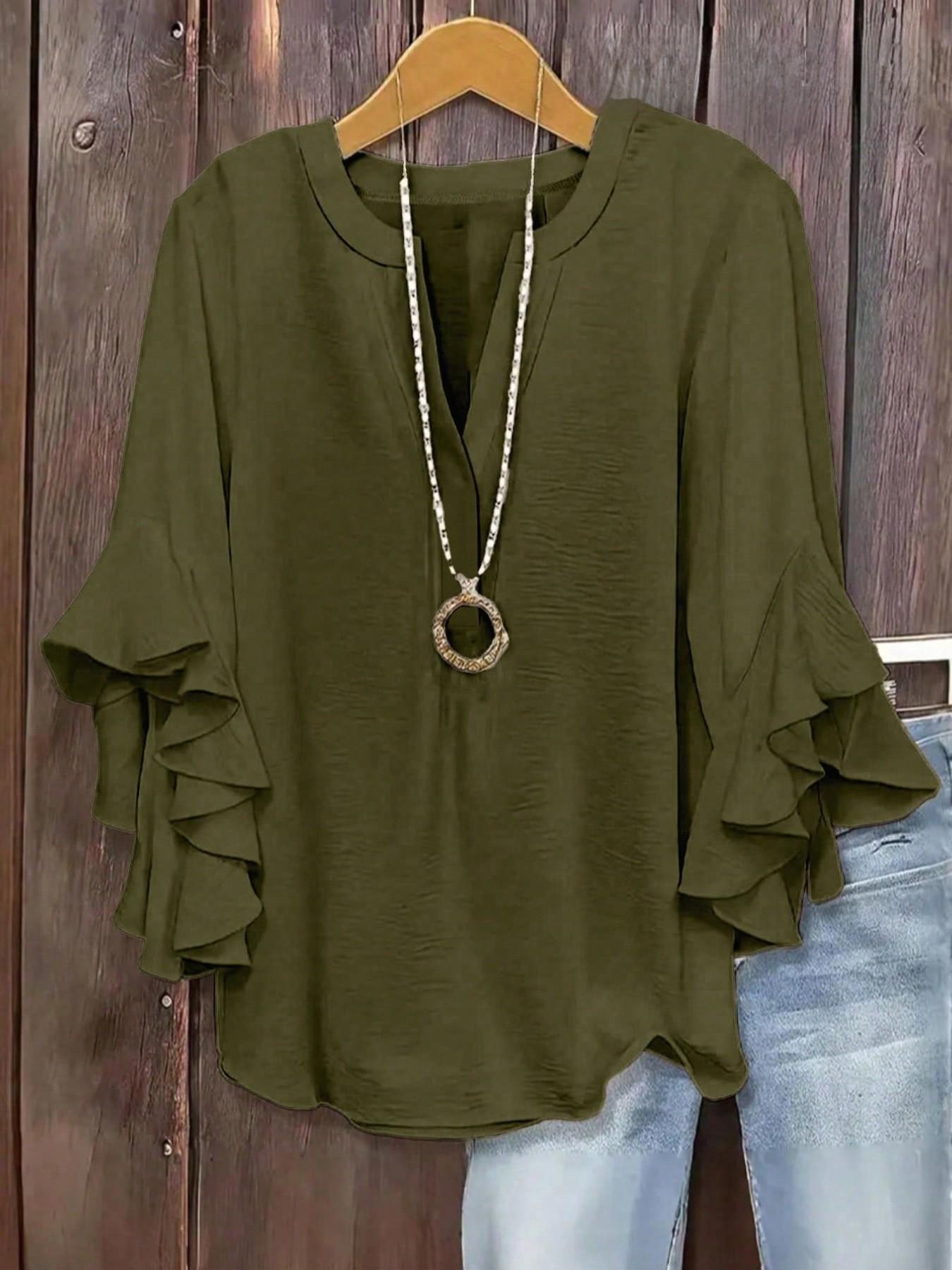 Plus-size women's V-neck blouse with ruffle sleeves and an elegant floral print