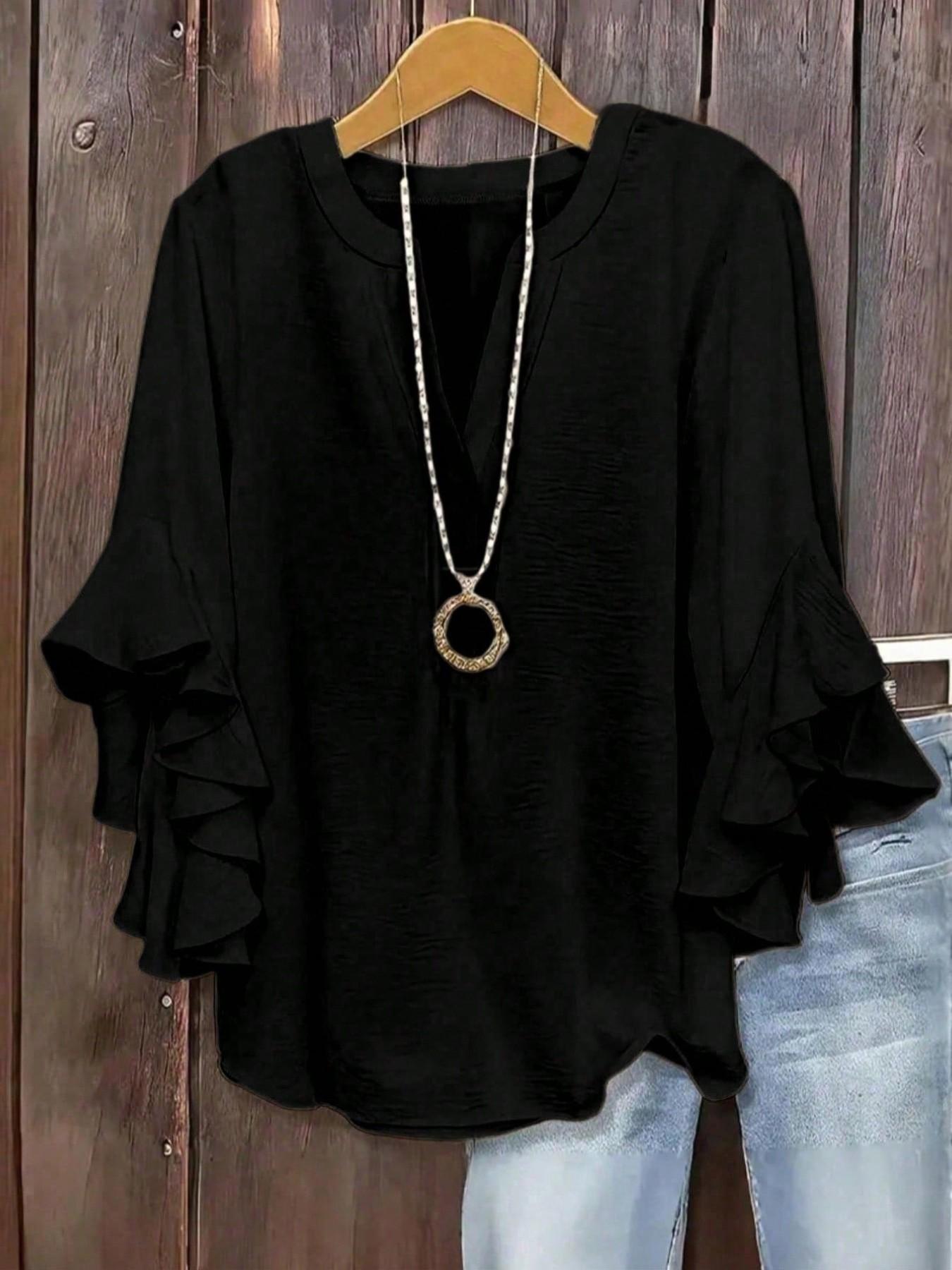 Plus-size women's V-neck blouse with ruffle sleeves and an elegant floral print