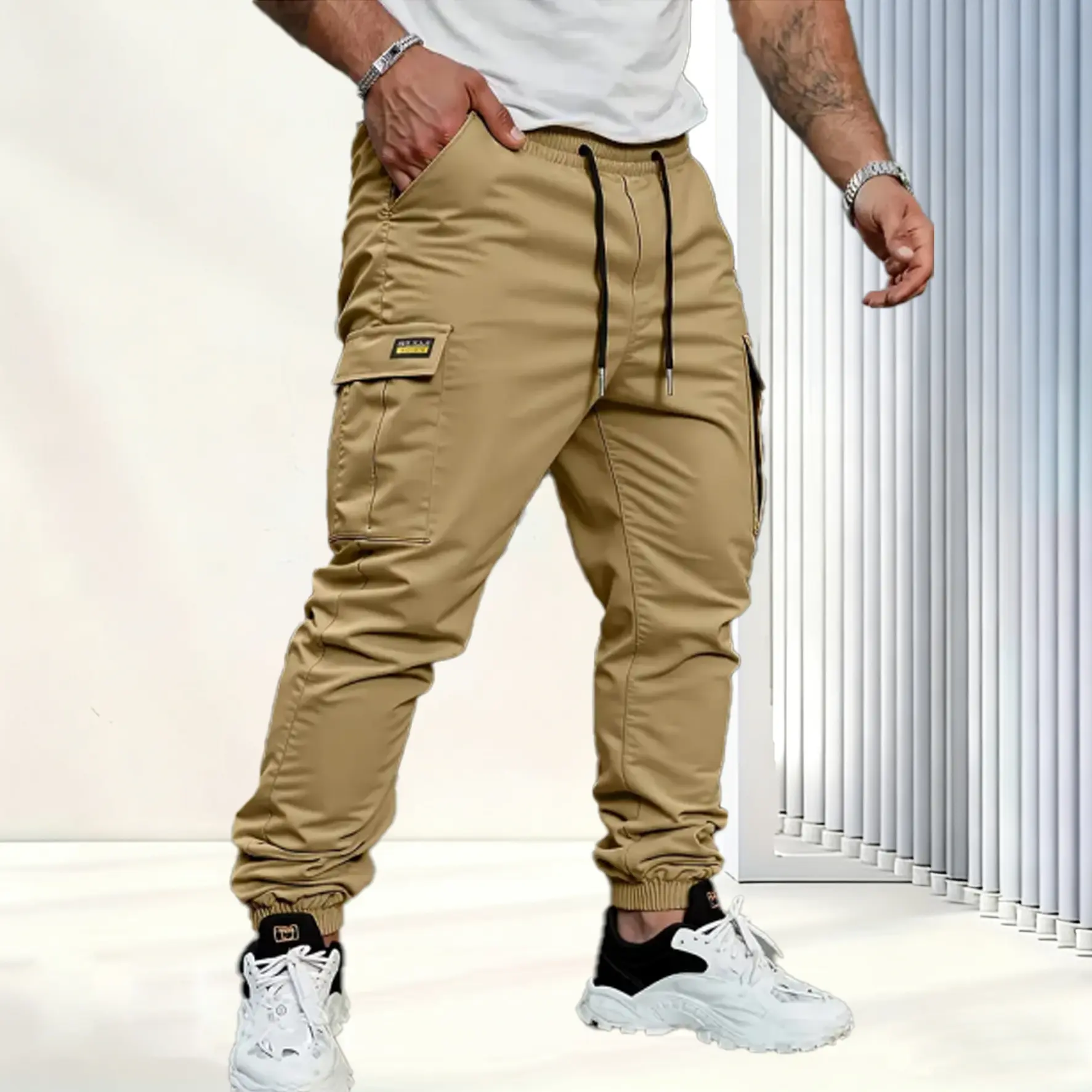 Men's solid color tactical work pants with multiple pockets and drawstring design