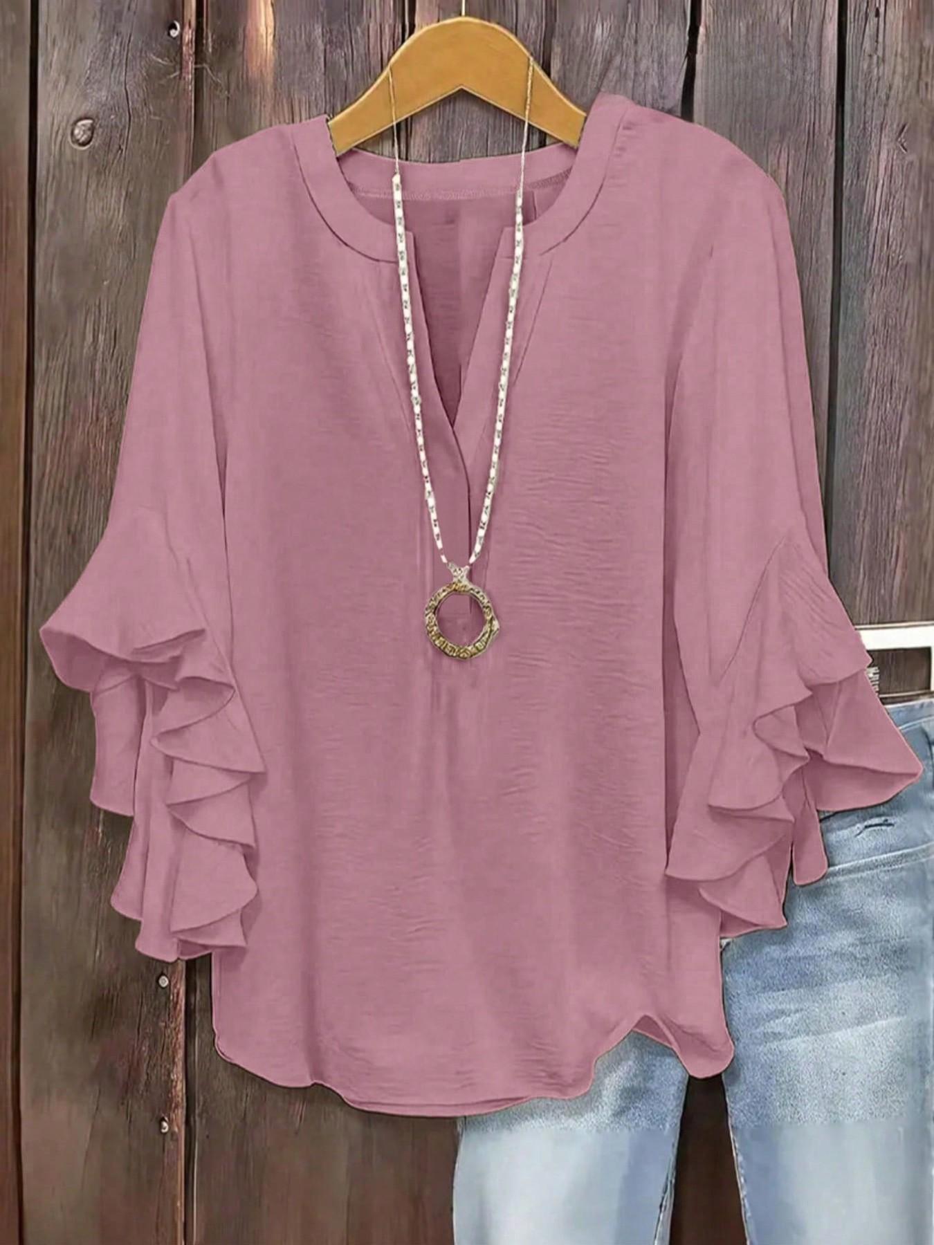 Plus-size women's V-neck blouse with ruffle sleeves and an elegant floral print