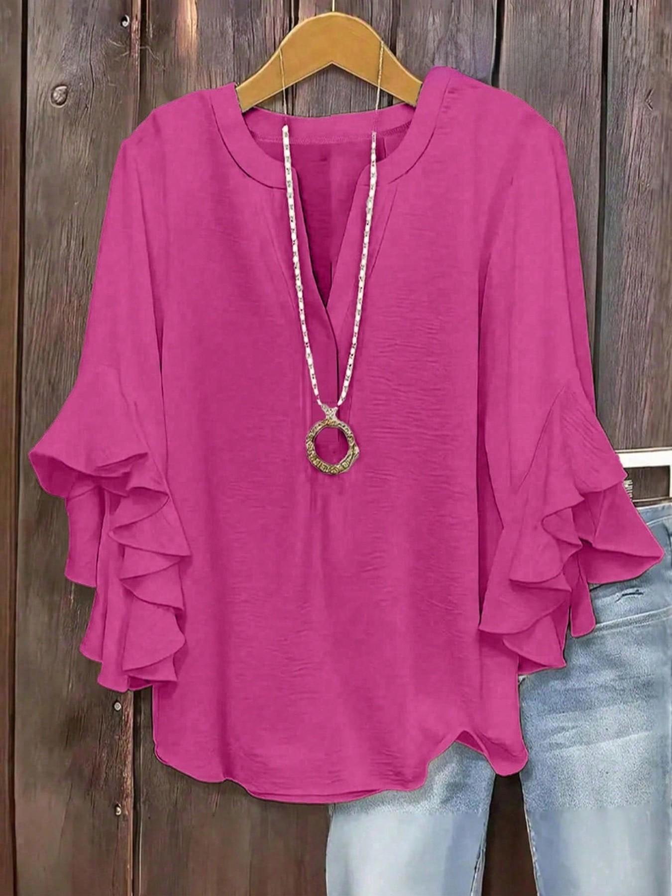 Plus-size women's V-neck blouse with ruffle sleeves and an elegant floral print