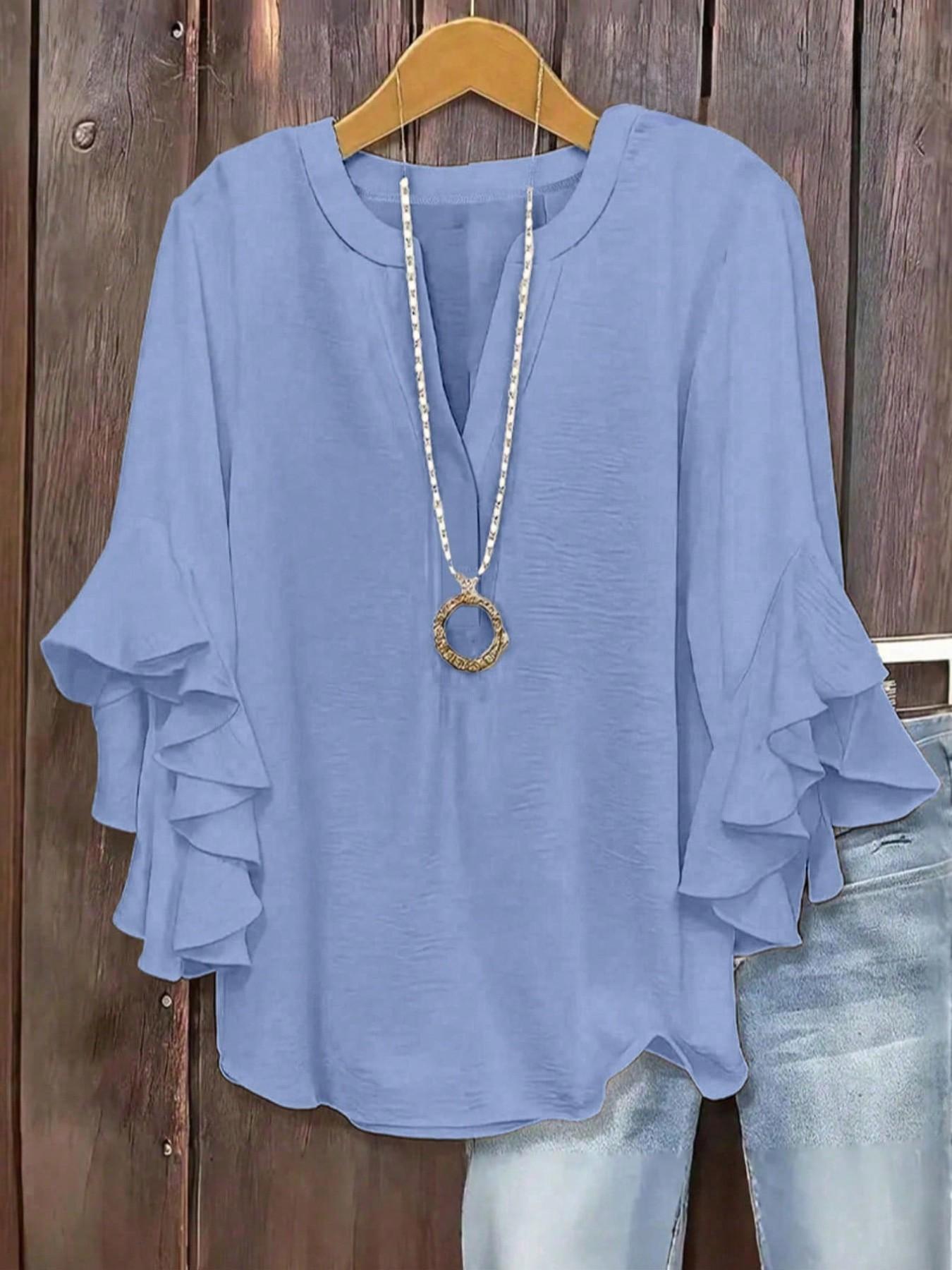 Plus-size women's V-neck blouse with ruffle sleeves and an elegant floral print