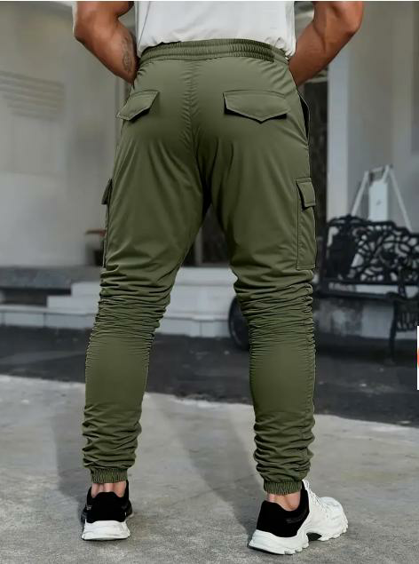 Men's solid color tactical work pants with multiple pockets and drawstring design