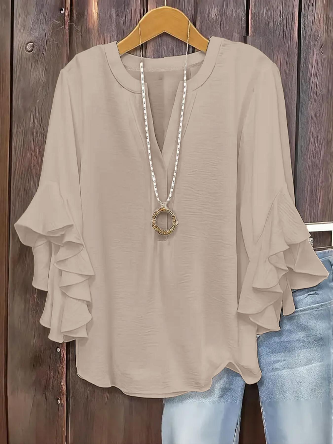Plus-size women's V-neck blouse with ruffle sleeves and an elegant floral print
